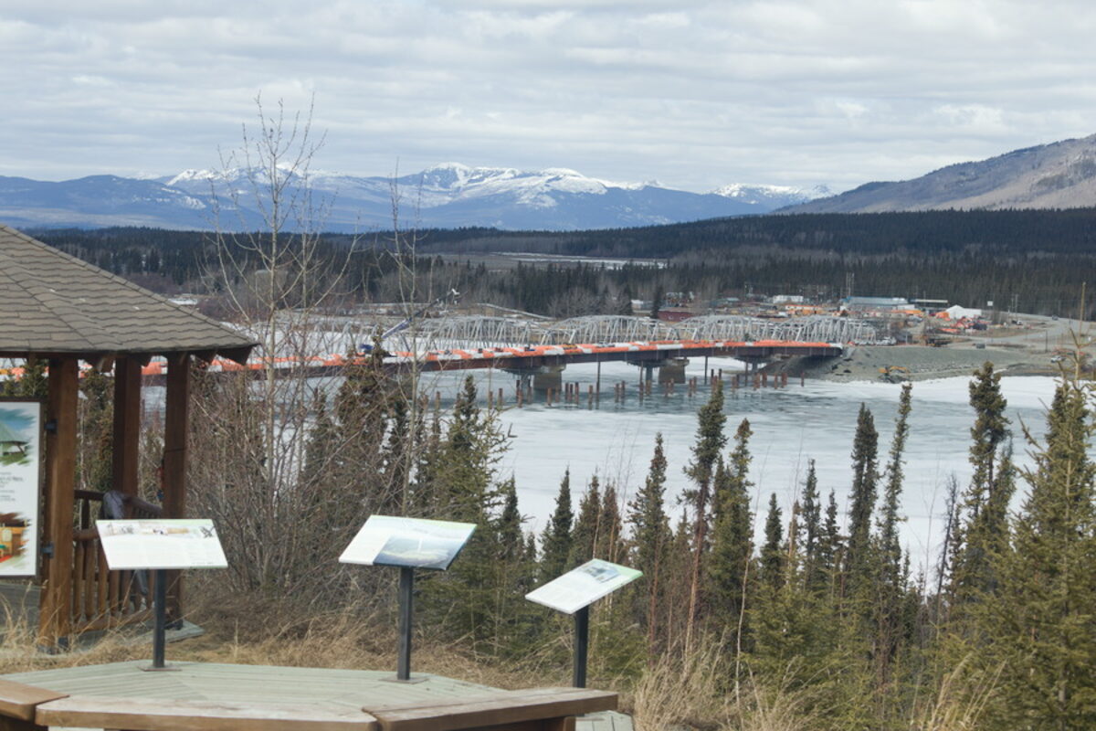 View of Watson Lake bridge and frozen river from overlook Yukon Canada