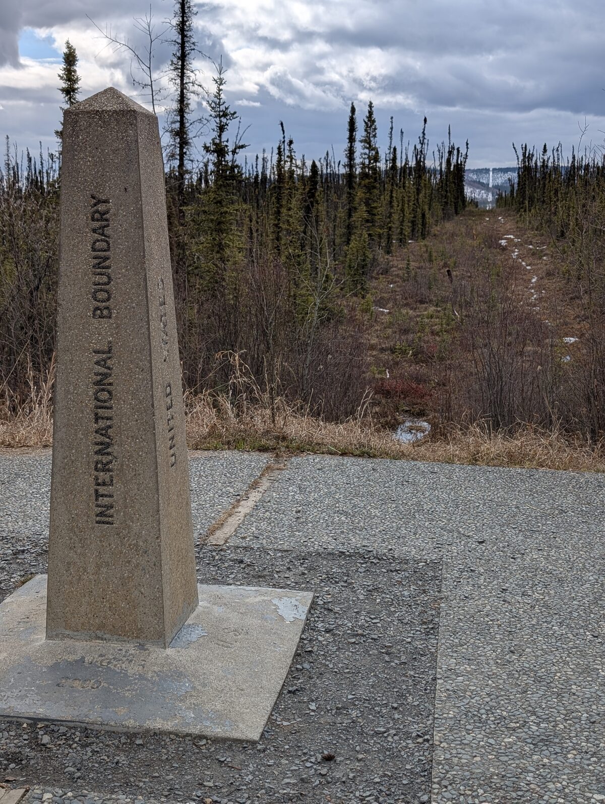 International Boundary monument at the US-Canada border on the Alaska Highway