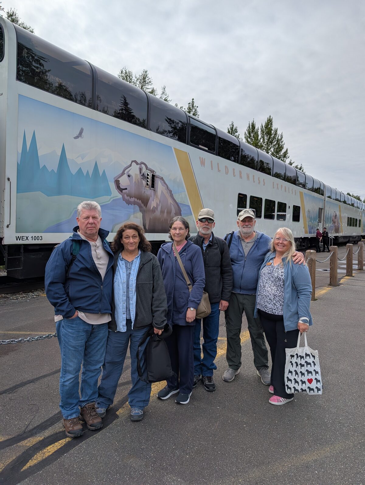 Group photo in front of the Alaska Railroad Wilderness Express train car - Left to Right : Joe, Debra, Vicky, Keith, Mike, Phyllis