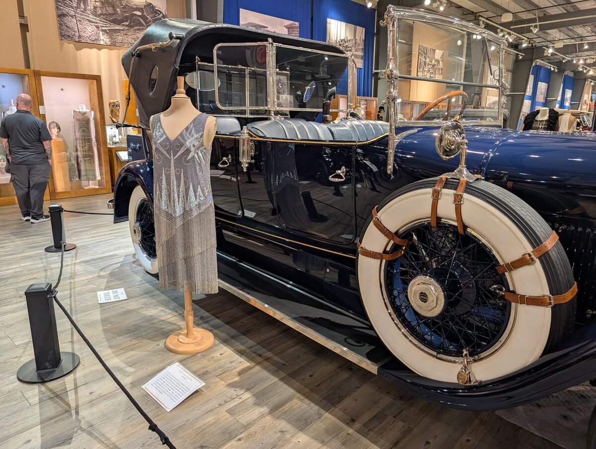 Vintage car and 1920s flapper dress display at the Fountainhead Car museum in Fairbanks