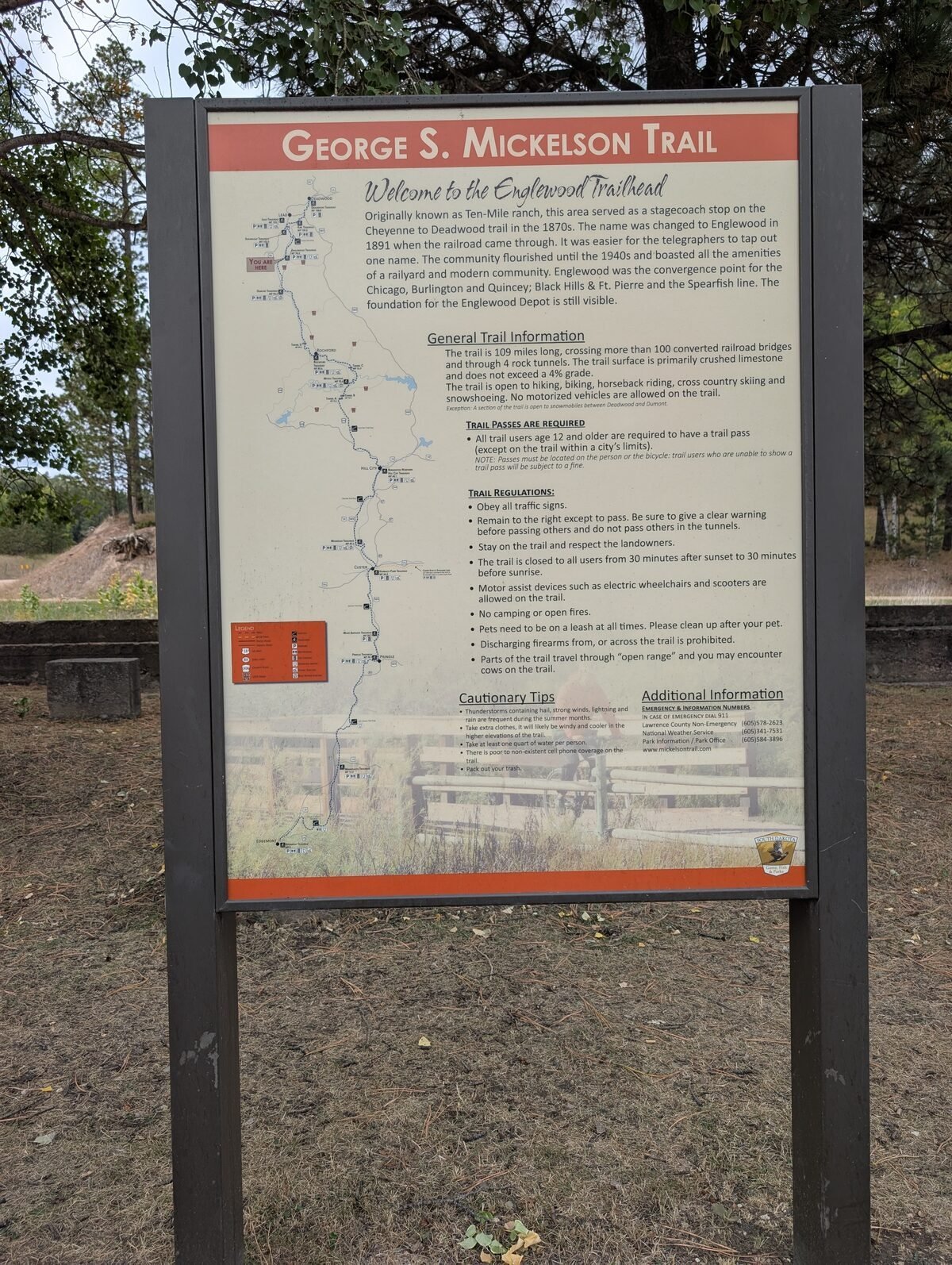 The trailhead info board — 109 miles, 100+ converted railroad bridges, and 4 rock tunnels