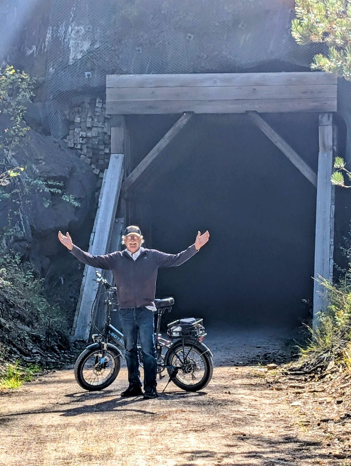 Kenny, celebrating at one of the trail's rock tunnels